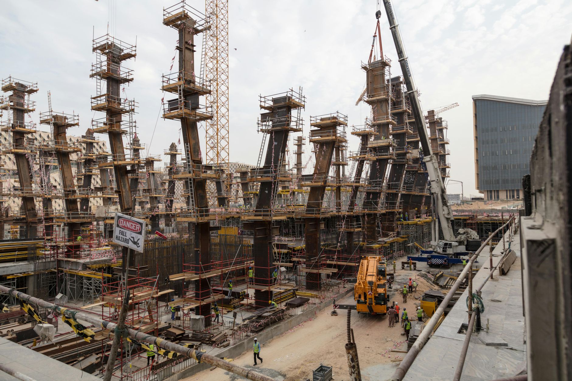 Construction site with steel framework under a project delivery programme