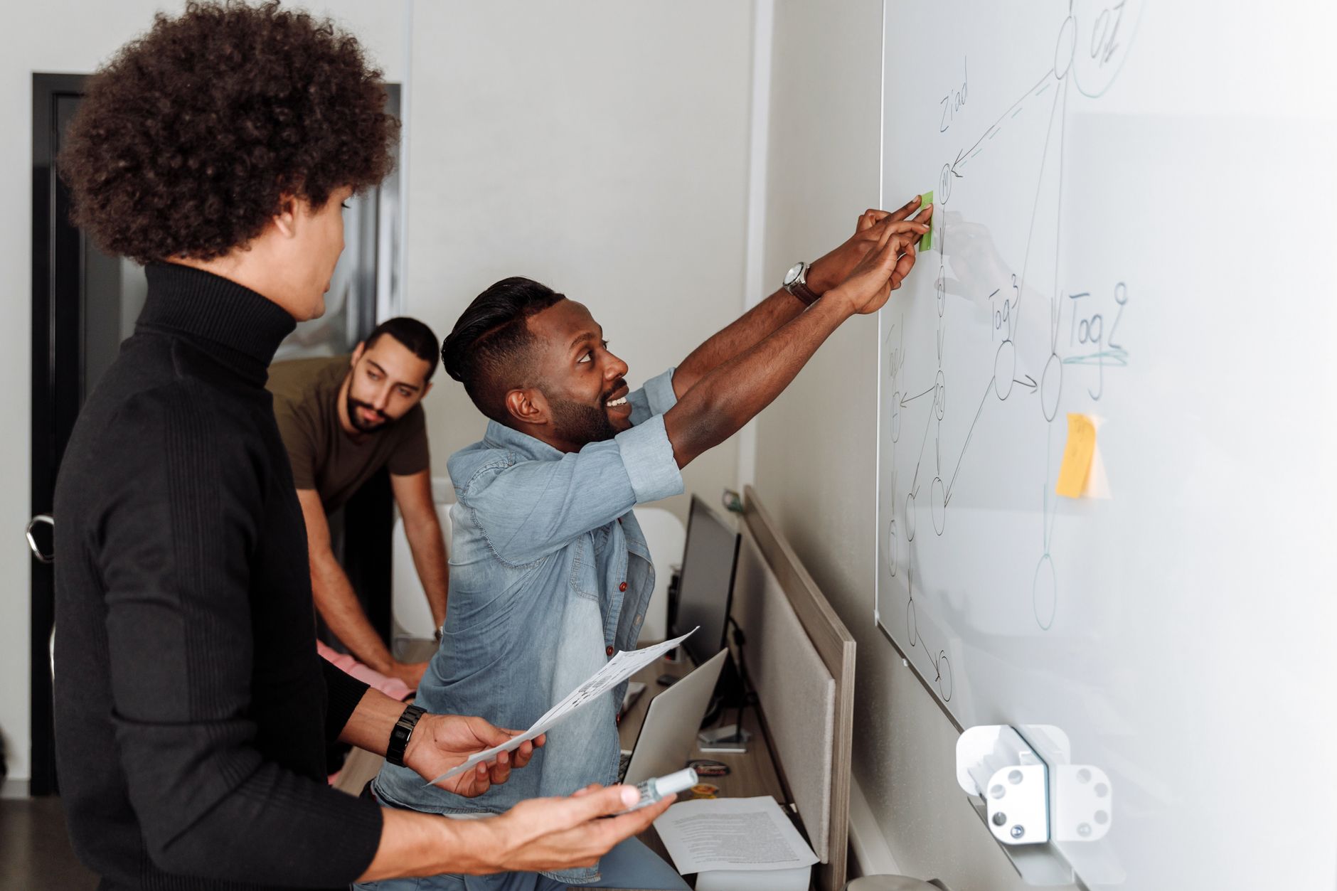 Colleagues reviewing a project plan together in the office